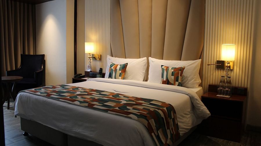 A bedroom featuring a functional working space for productivity at BluSalzz Residence, Amritsar